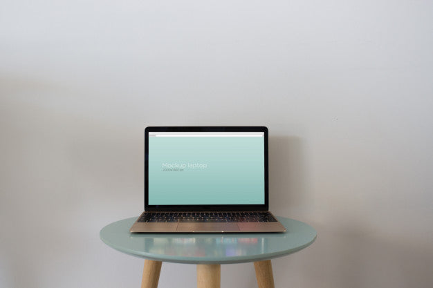 Laptop Mockup On Round Table Psd