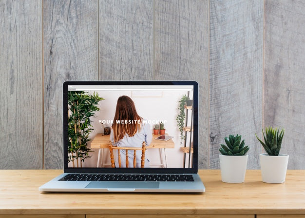 Laptop Mockup On Table With Plants Psd