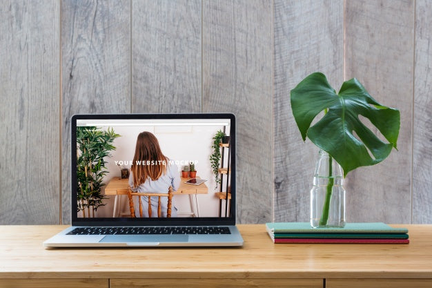 Laptop Mockup On Table With Plants Psd