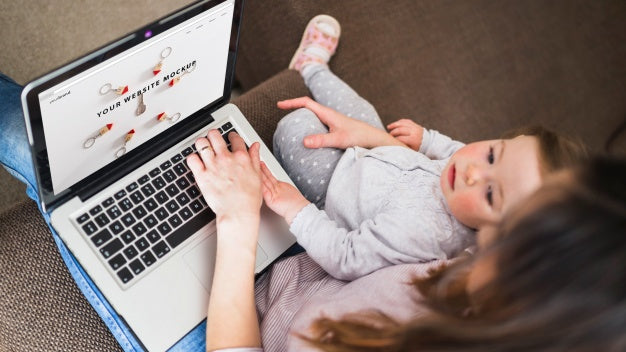 Laptop Mockup With Mother And Daughter Psd