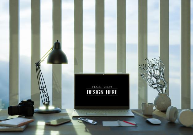 Laptop On Desk In Workspace Mockup Psd