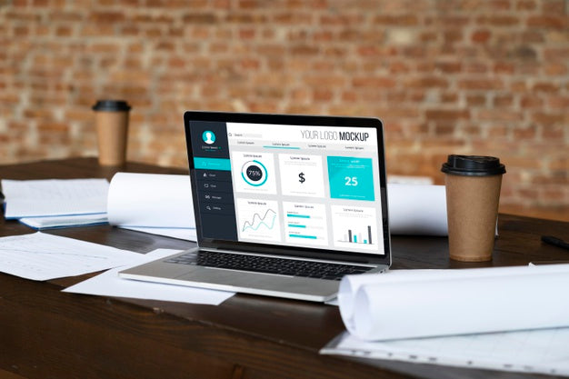 Laptop On Table And Paperwork Psd