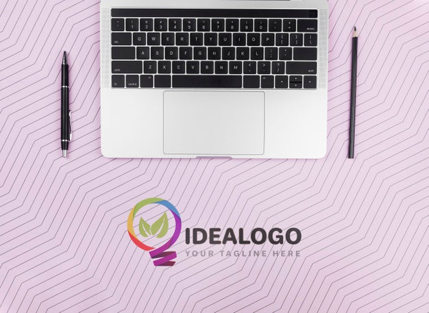 Laptop With Pen And Pencil On Desk Psd