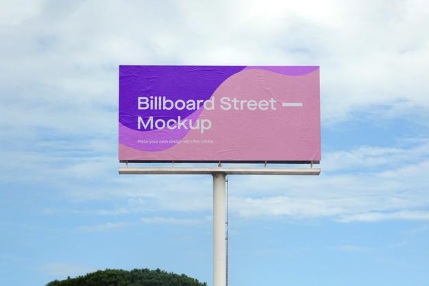 Large Billboard Mockup On Blue Sky With Clouds Psd