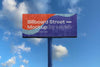 Large Billboard Mockup On Blue Sky With Clouds Psd