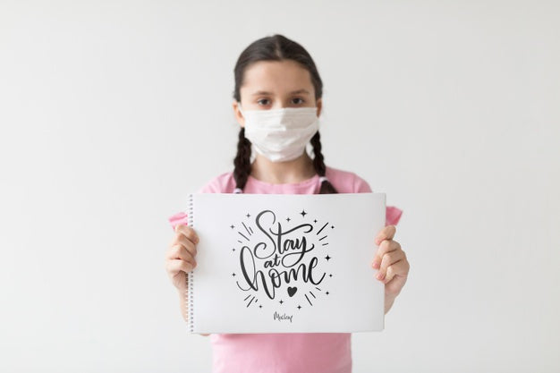 Little Girl Holding A Stay At Home Card Psd