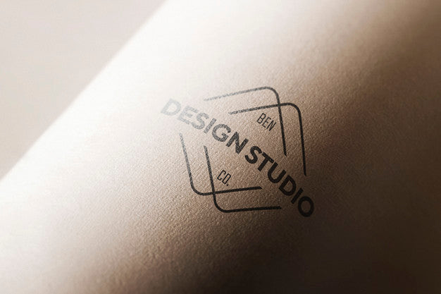 Logo Mockup In Curved Paper Psd