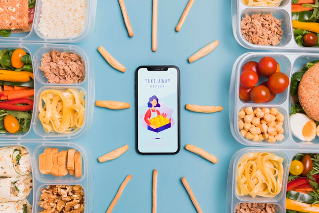 Lunch At Work With Mobile On Desk Psd