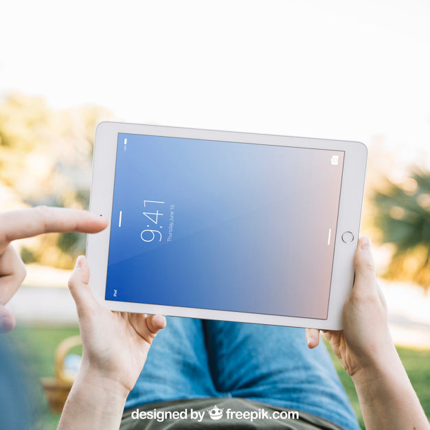 Lying Man Holding Tablet Mockup Psd