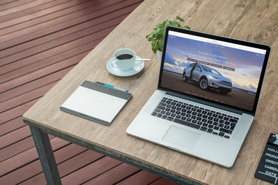 Macbook Next To Morning Coffee Cup Mockup Scene