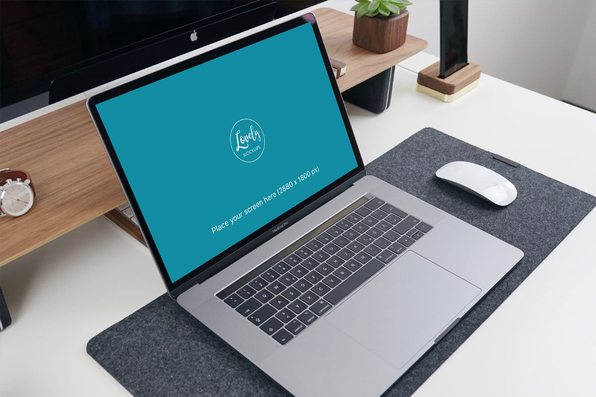 Macbook Pro 15" Mockup on the Office Table