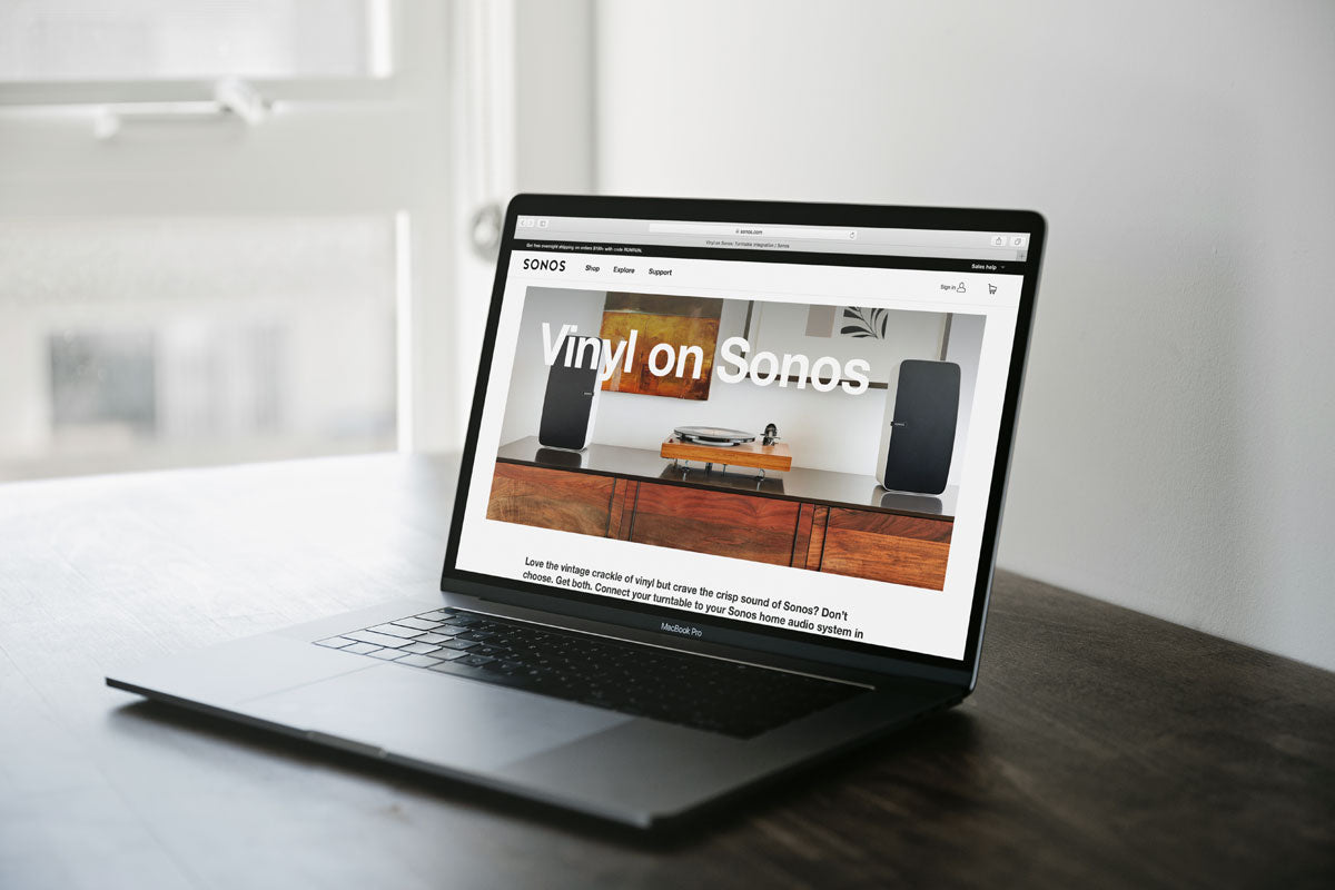 Space Grey Macbook Mockup Pro On A Brown Table