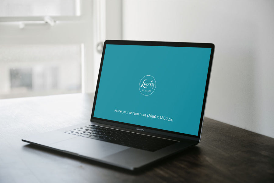 Space Grey Macbook Mockup Pro On A Brown Table