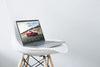 Creative 15" Macbook Pro Mockup On A Modern Chair