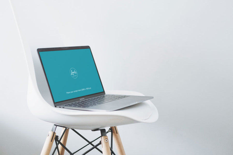 Creative 15" Macbook Pro Mockup On A Modern Chair