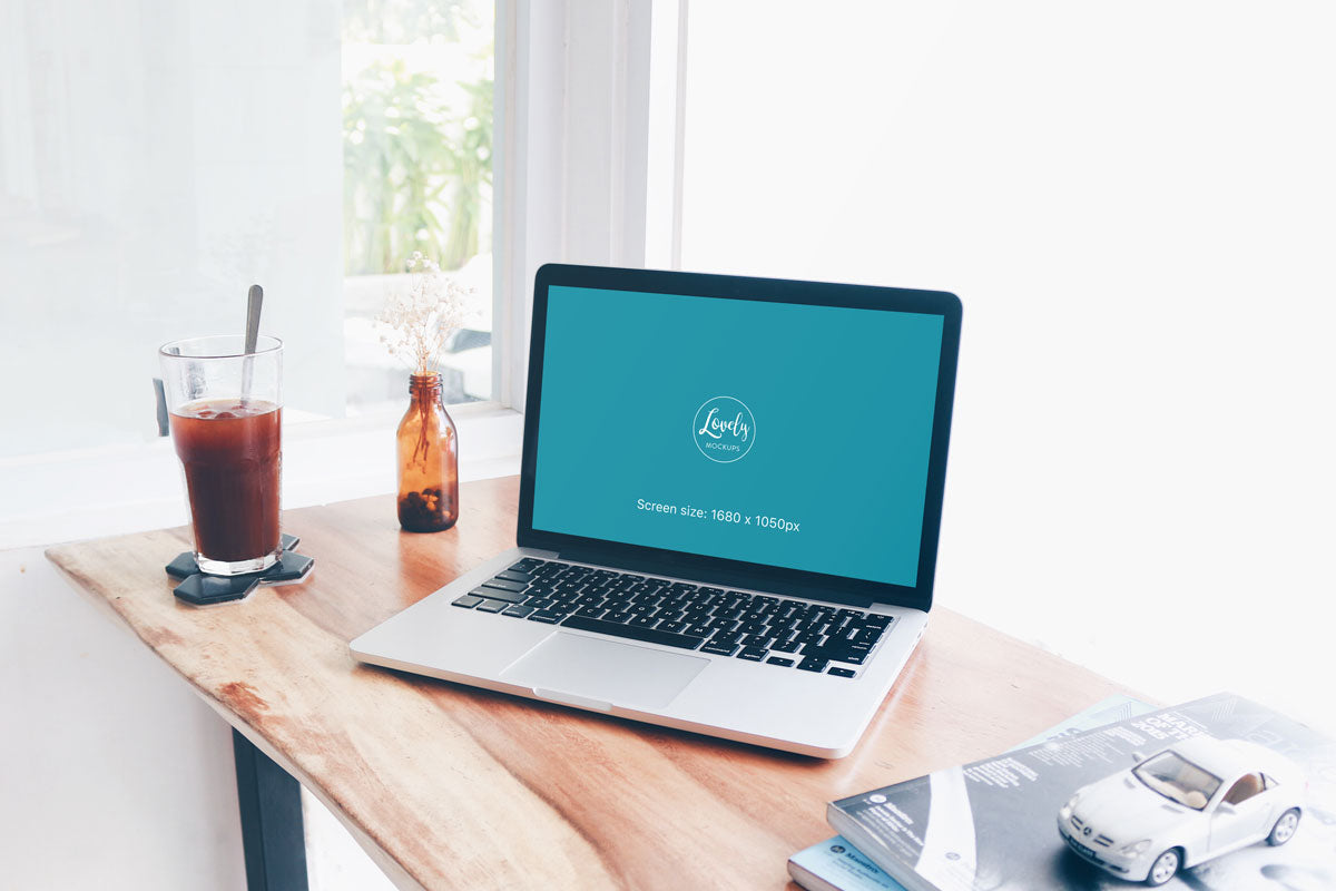 Macbook Pro Mockup At The Window