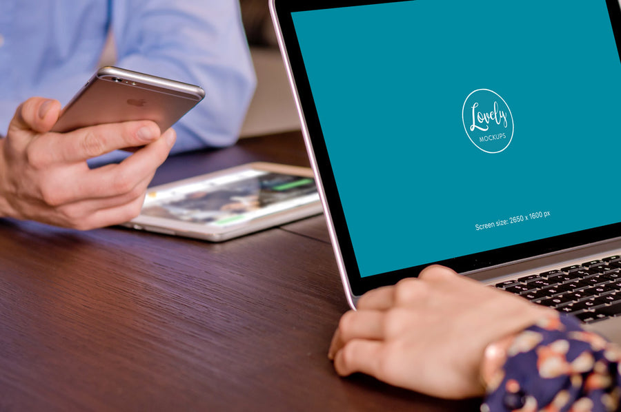 Macbook Pro Mockup in a Meeting