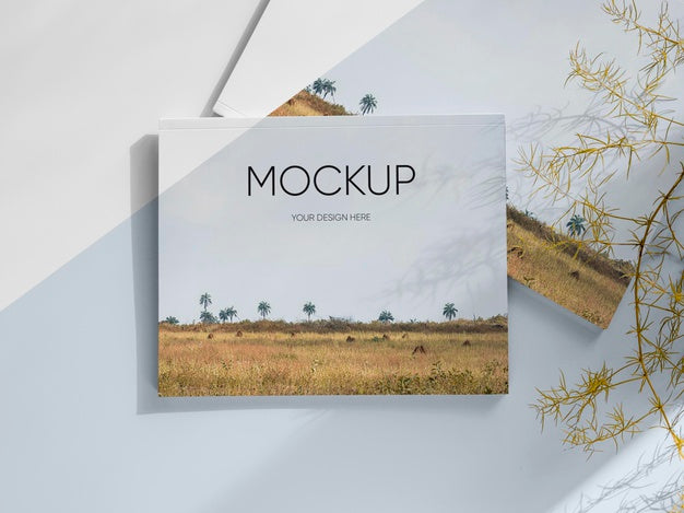 Magazine And Leaves Arrangement Above View Psd