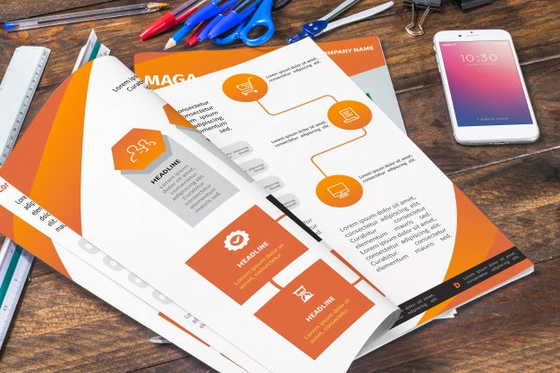 Magazine And Smartphone Mockup On Wooden Table With Pens And Rulers Psd