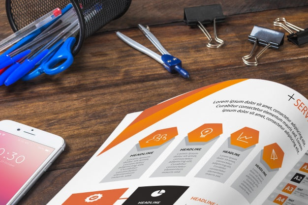 Magazine And Smartphone Mockup On Wooden Table With Pens And Rulers Psd