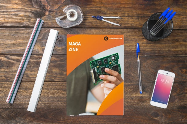 Magazine And Smartphone Mockup On Wooden Table With Pens And Rulers Psd