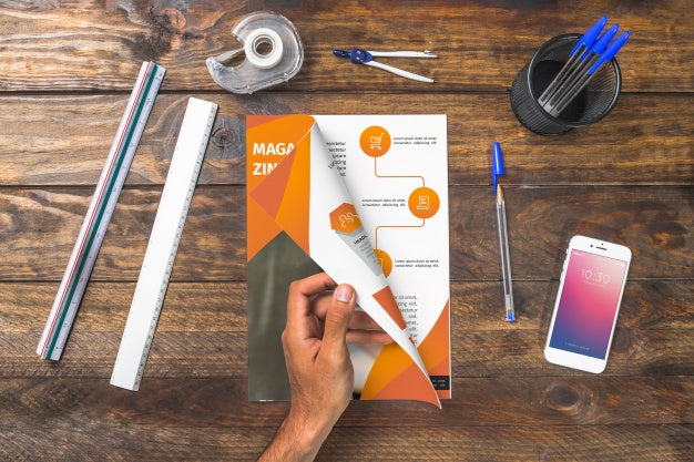 Magazine And Smartphone Mockup On Wooden Table With Pens And Rulers Psd