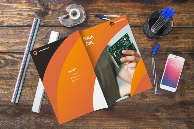 Magazine And Smartphone Mockup On Wooden Table With Pens And Rulers Psd