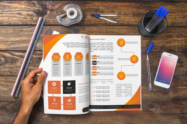 Magazine And Smartphone Mockup On Wooden Table With Pens And Rulers Psd