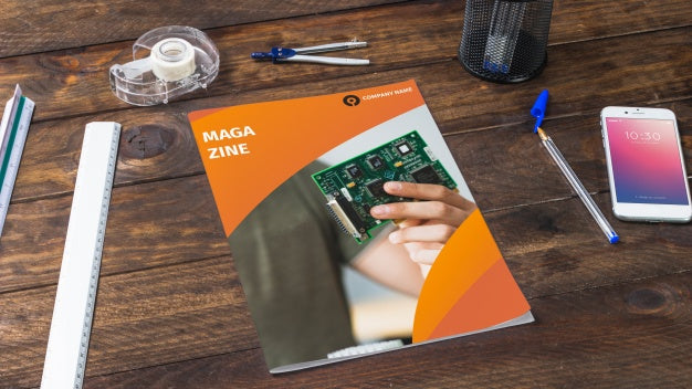 Magazine And Smartphone Mockup On Wooden Table With Pens And Rulers Psd