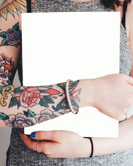 Magazine Mockup Held By A Tattooed Woman