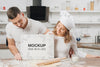 Male And Female Chefs Holding Blank Placard In The Kitchen Psd