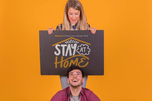 Man And Woman Holding A Sign Concept Mock-Up Psd