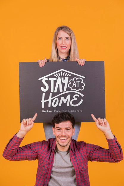 Man And Woman Holding A Sign Concept Mock-Up Psd