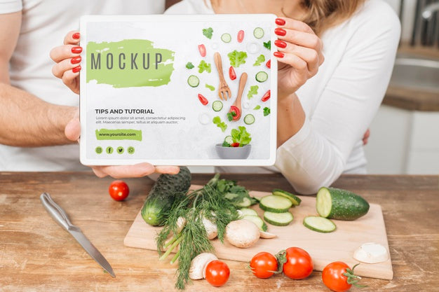 Man And Woman Holding Placard In The Kitchen While Cooking Psd