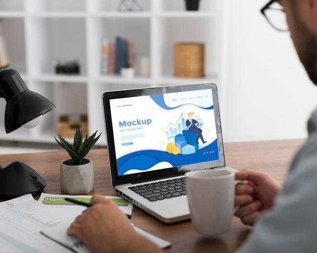 Man At Desk With Laptop Mock-Up Psd