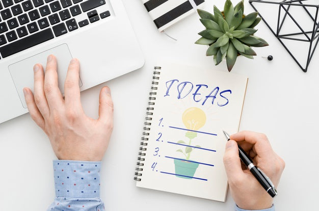 Man At Desk Writing On Notebook Mock-Up Psd