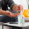 Man At Home Using Mock-Up Disinfectant Psd
