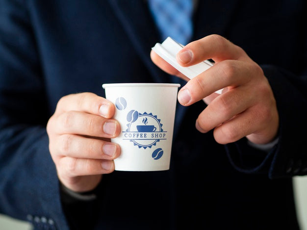 Man Holding A Tea Cup Mock-Up Psd