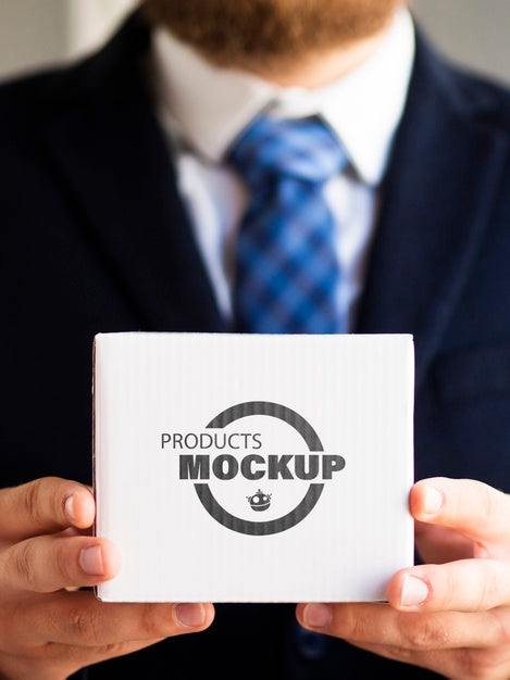 Man Holding A White Cardboard Mock-Up Psd