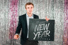 Man Holding Blackboard For New Year Psd