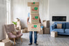 Man Holding Boxes With Objects Indoors Psd