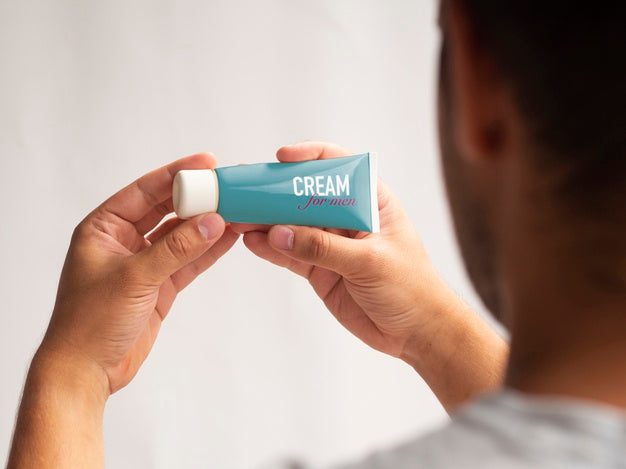 Man Holding Cream For Man Mock-Up Psd