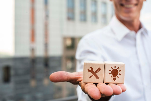 Man Holding Dices With Company Ideas Psd