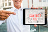 Man Holding Digital Tablet And Pointing At It Psd