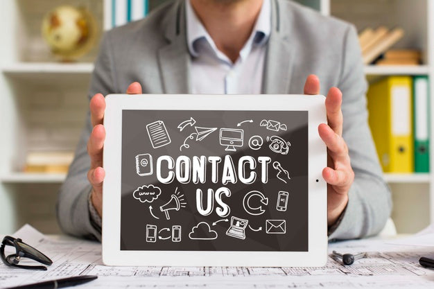 Man Holding Digital Tablet With Contact Us Lettering Psd