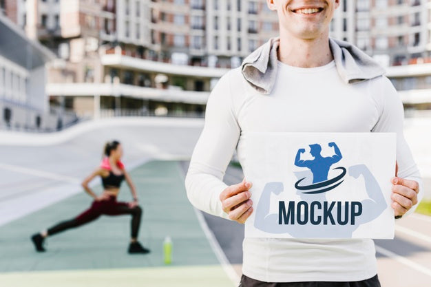 Man Holding Fitness Mock-Up Front View Psd