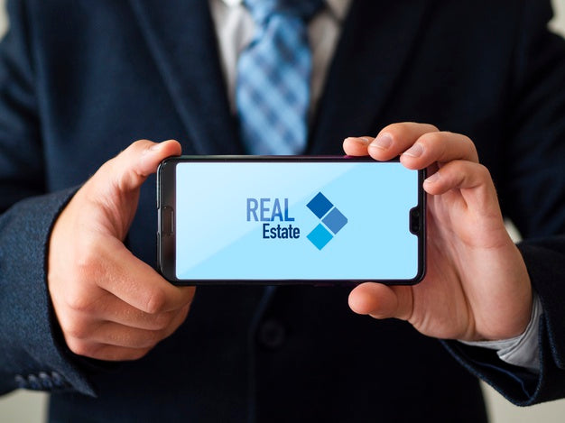 Man Holding His Phone Mock-Up Psd