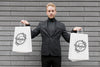 Man Holding In Each Hand Shopping Bags Psd