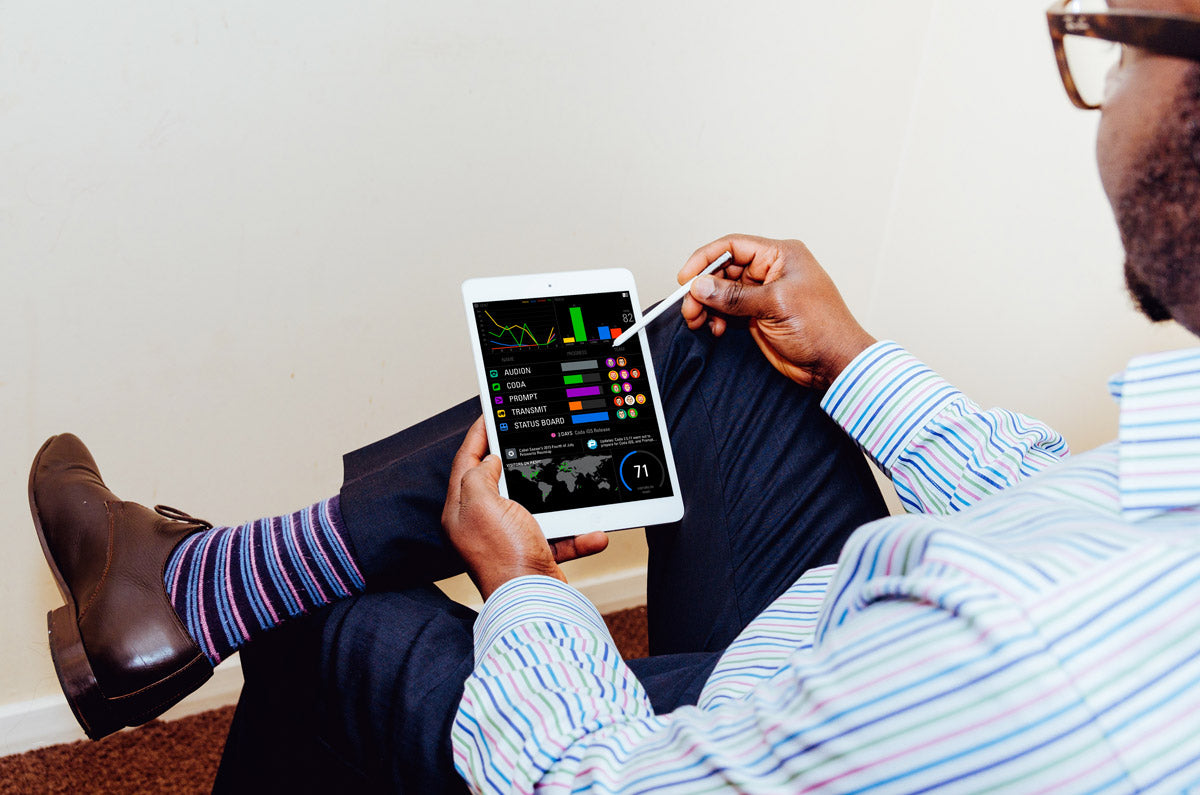 Man Typing on an White iPad Mockup