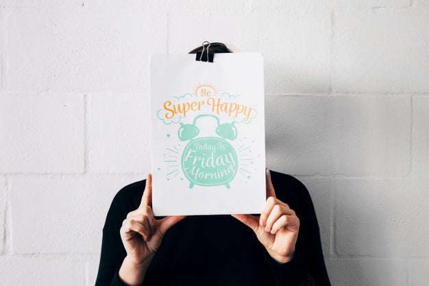 Man Holding Paper Mockup In Front Of Face Psd